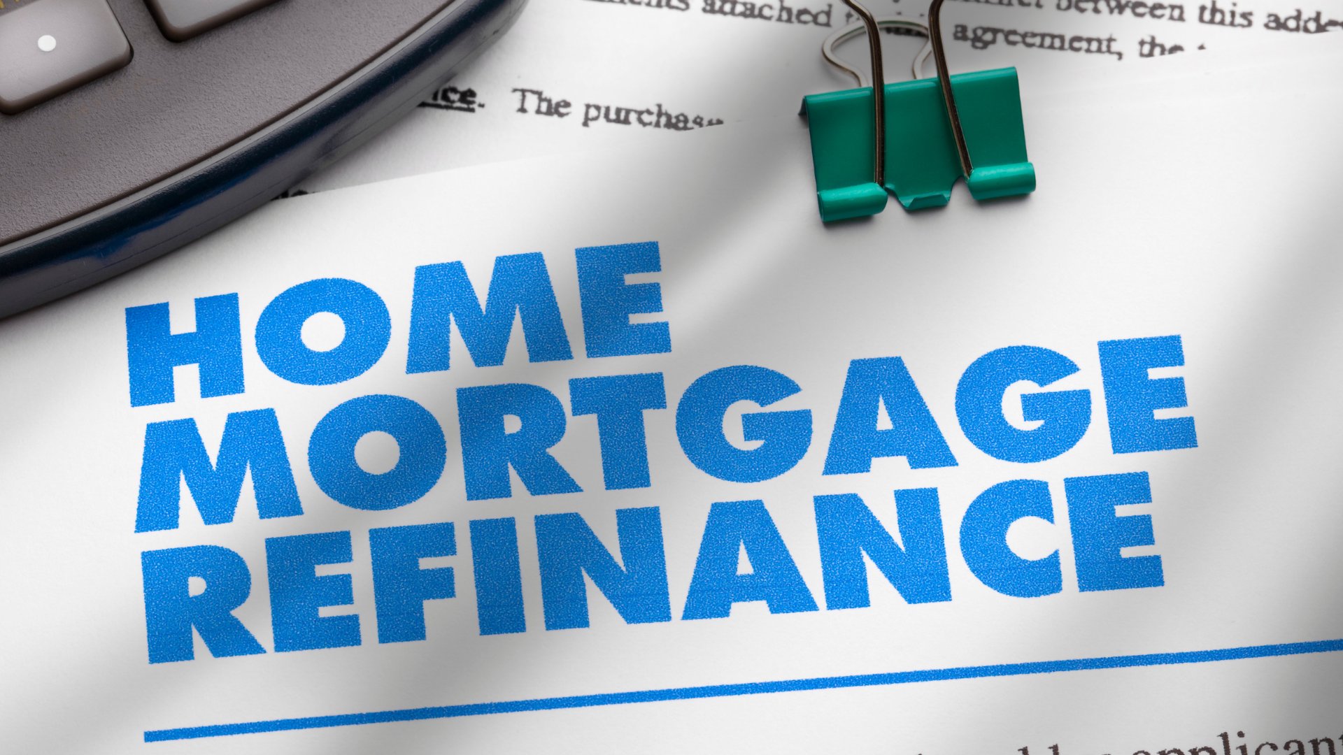 Mortgage refinance documents on a desk
