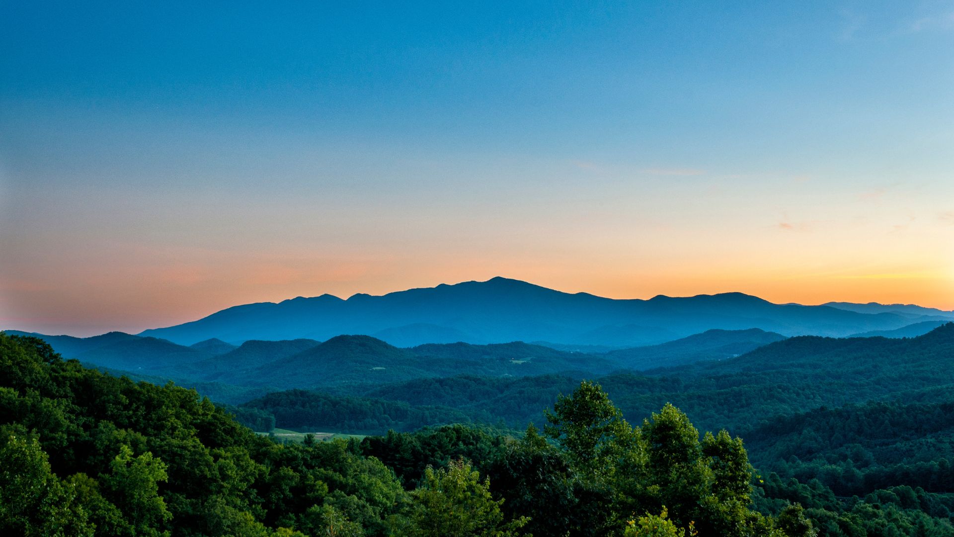 Blue mountain ridges at sunset
